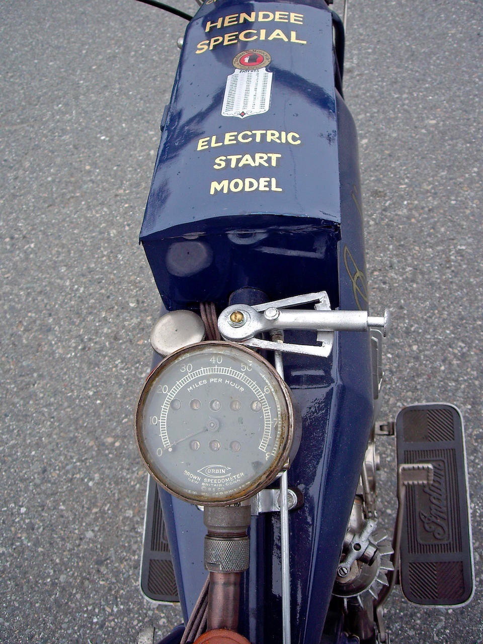 a detail photo of a Hendee Special Motorcycle with an early electric start system