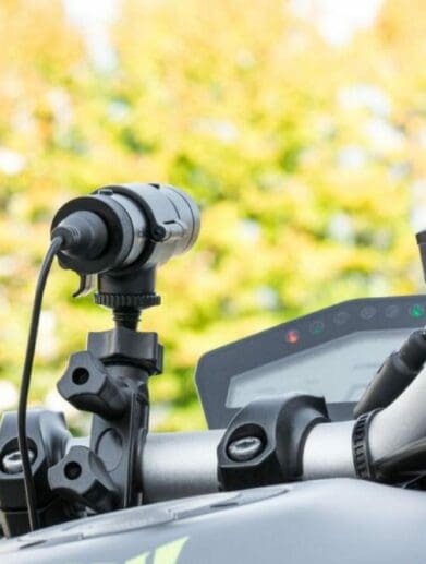 An image of a dash cam mounted on the tank of a Yamaha MT-09.