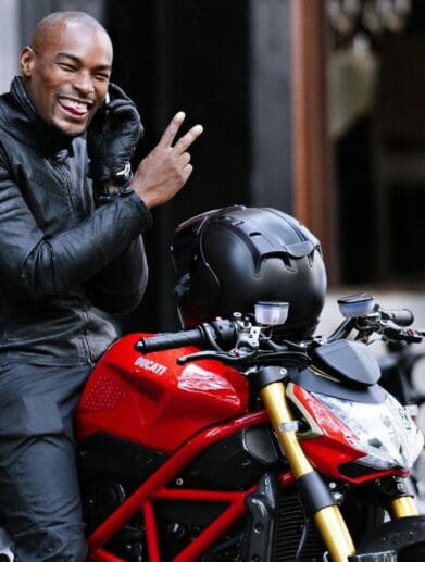 Tyson Beckford with one of his motorcycles. Media sourced from Pinterest.