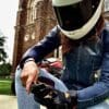 Author squatting outside while wearing Racer USA Women's Pitlane Gloves