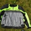 Scorpion Vortex Air Jacket lying front-side-up on grass