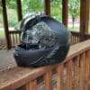 Sena Impulse Modular Helmet sitting on wooden railing