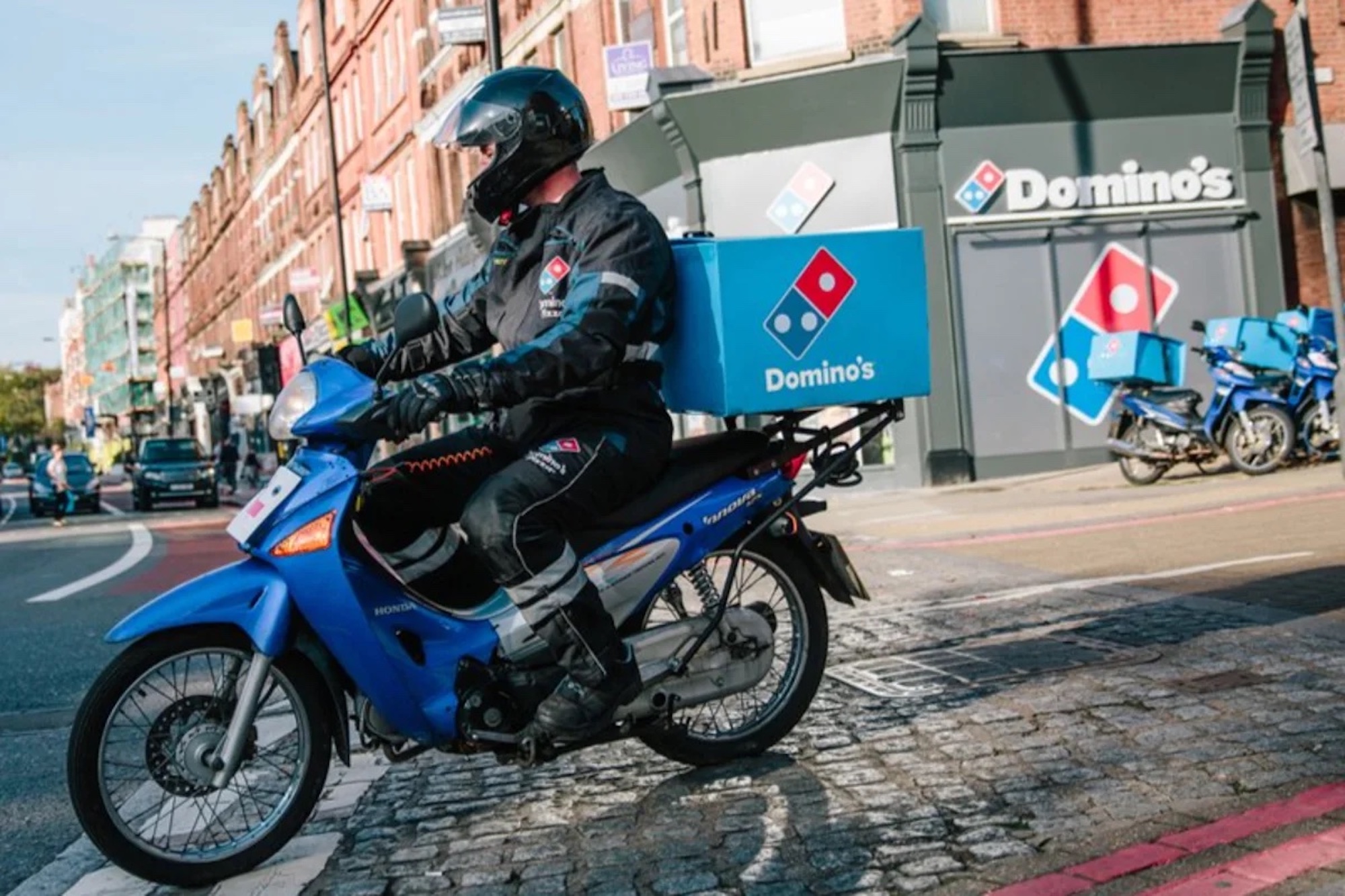 An urban motorcyclist riding with a food delivery. Media sourced from the Evening Standard.