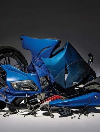 A pile of motorcycle parts, symbolic of what typically happens to pinched bikes as robbers source bike guts for money. Media sourced from Family Instructor.