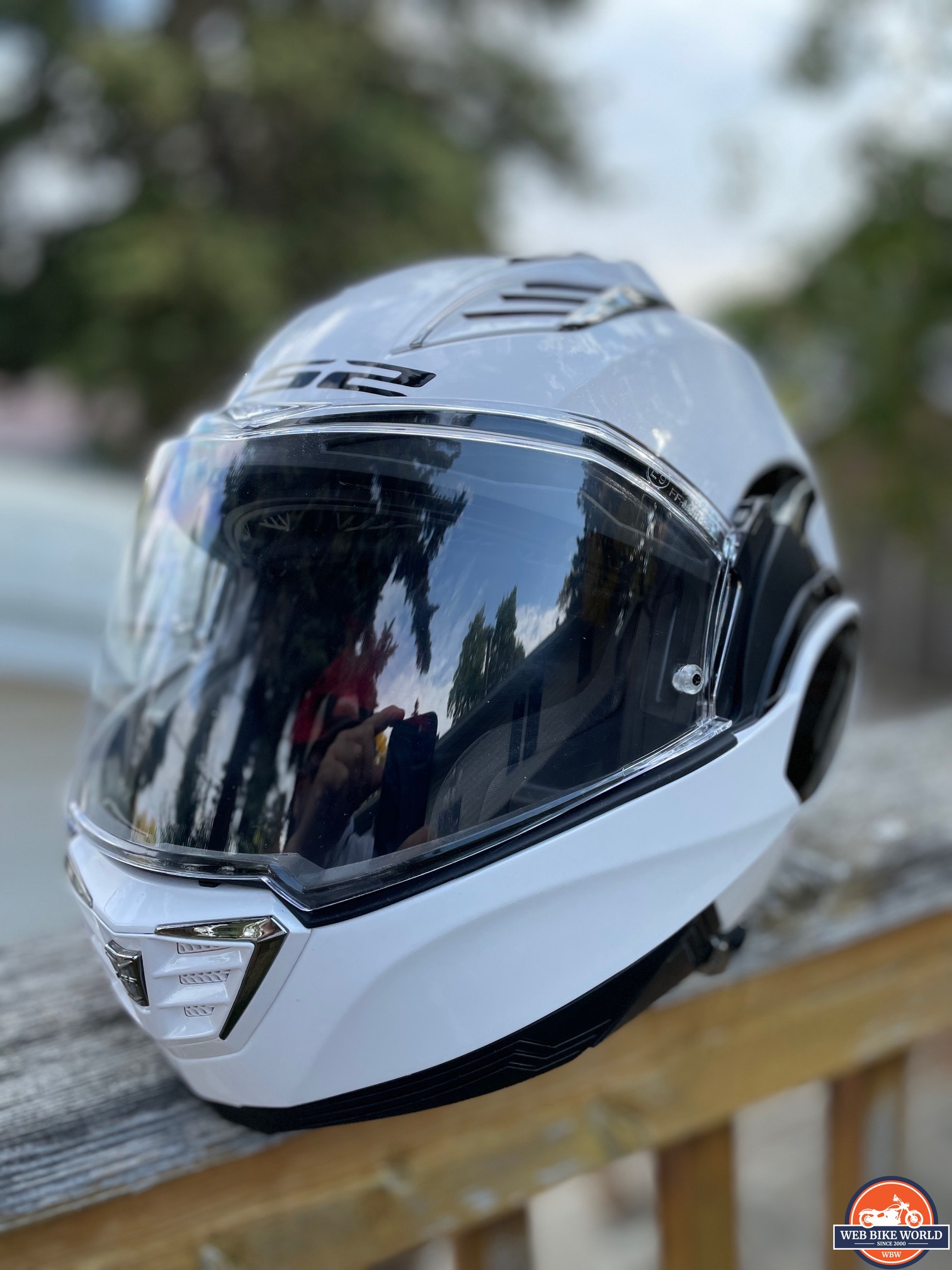 LS2 Valiant II helmet with visor down resting on railing