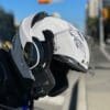 LS2 Valiant II helmet with visor open hanging from bike handlebars