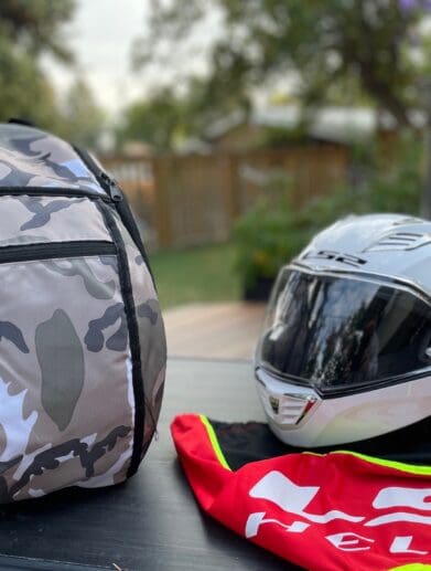 LS2 Valiant II modular helmet next to backpack
