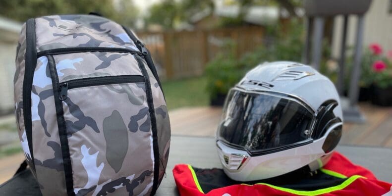 LS2 Valiant II modular helmet next to backpack