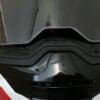 Close up of front of 6D ATS-1R helmet with face shield partially raised