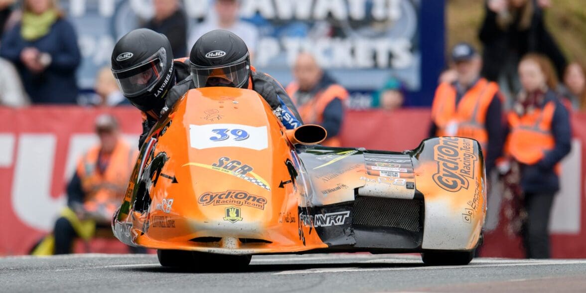 A view of Cesar Chanel and Olivier Lavorel in the opening race of the sidecar category for Isle of Man TT. Media sourced from ITV Hub.
