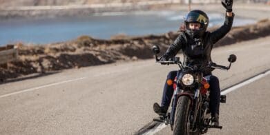 A female motorcyclist making her way down the highway. Media sourced from Conde Nast Traveler.