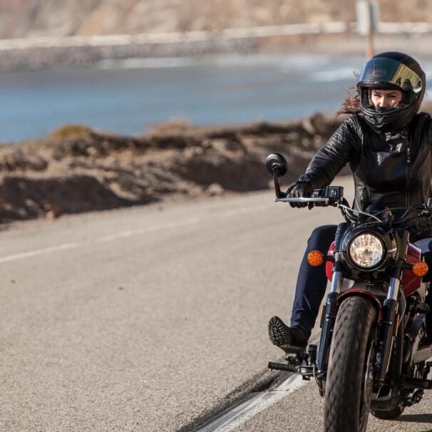 A female motorcyclist making her way down the highway. Media sourced from Conde Nast Traveler.