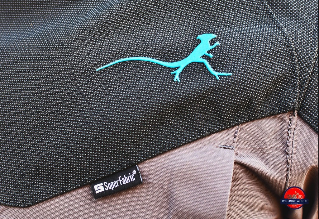 The Mosko Moto brand logo is a Basilisk lizard silhouette.
