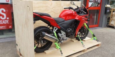 Red Honda CBR on a shipping pallet