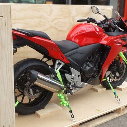 Red Honda CBR on a shipping pallet