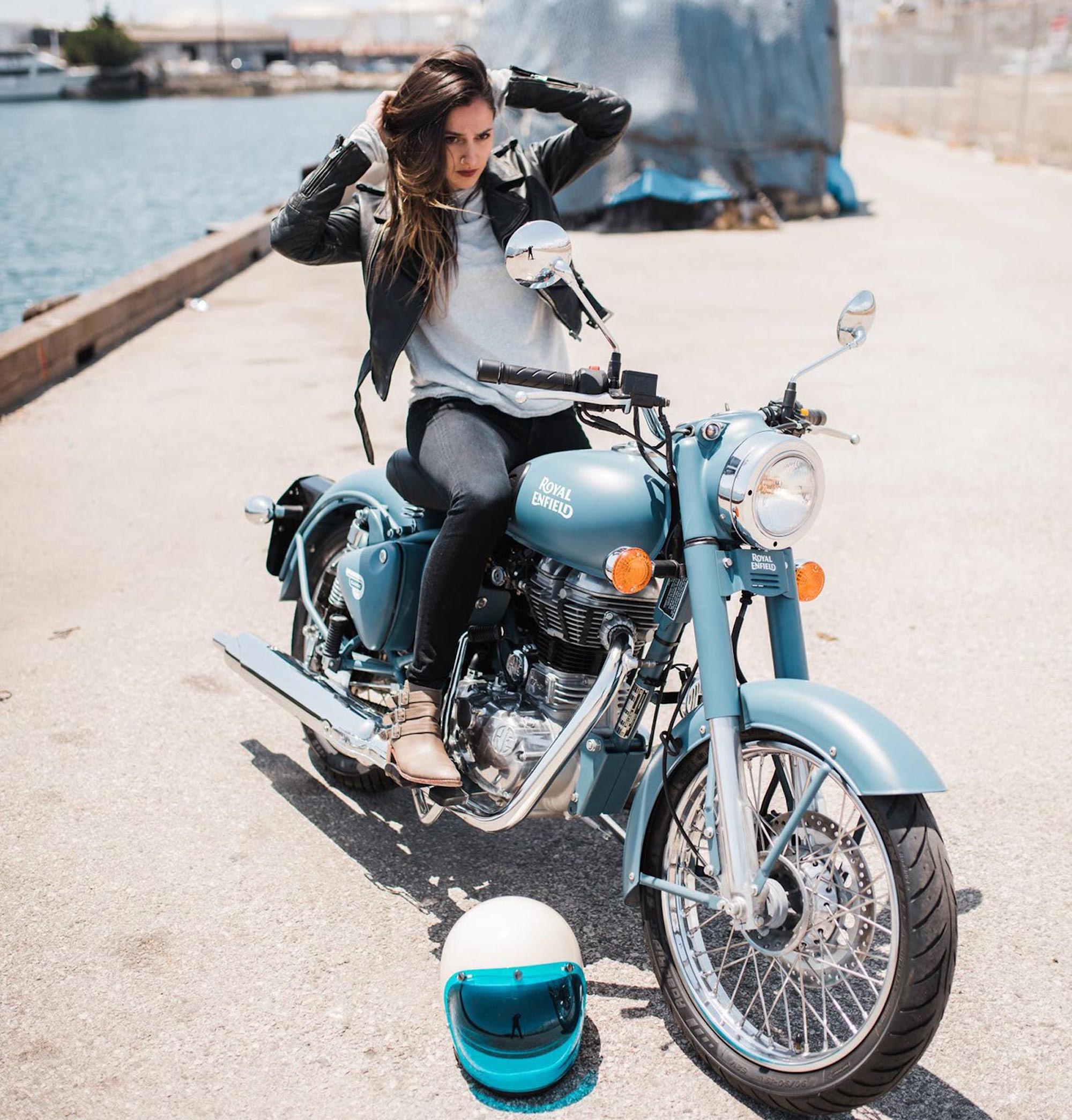 A rider enjoying the rays on a gorgeously painted Royal Enfield bike. Media sourced from Total Motorcycle.