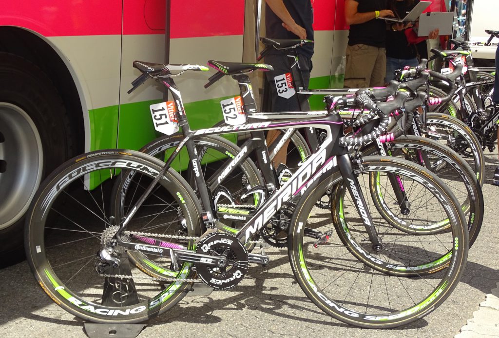 Merida road race bicycles lined up outside at event
