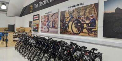 Row of Haibike and Raleigh electric bike models in store