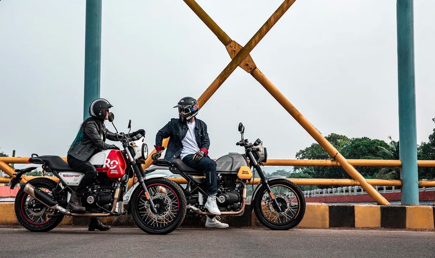 Two 2022 Royal Enfield Scram 411 motorcycles on a bridge in India