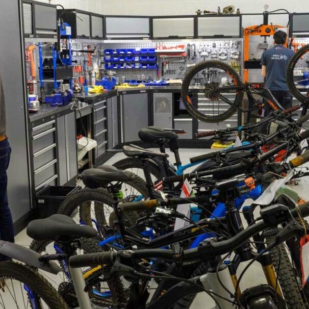 Technicians in workshop service multiple electric bike models