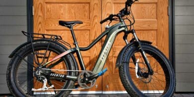 Aventon eBike leaning against wooden door