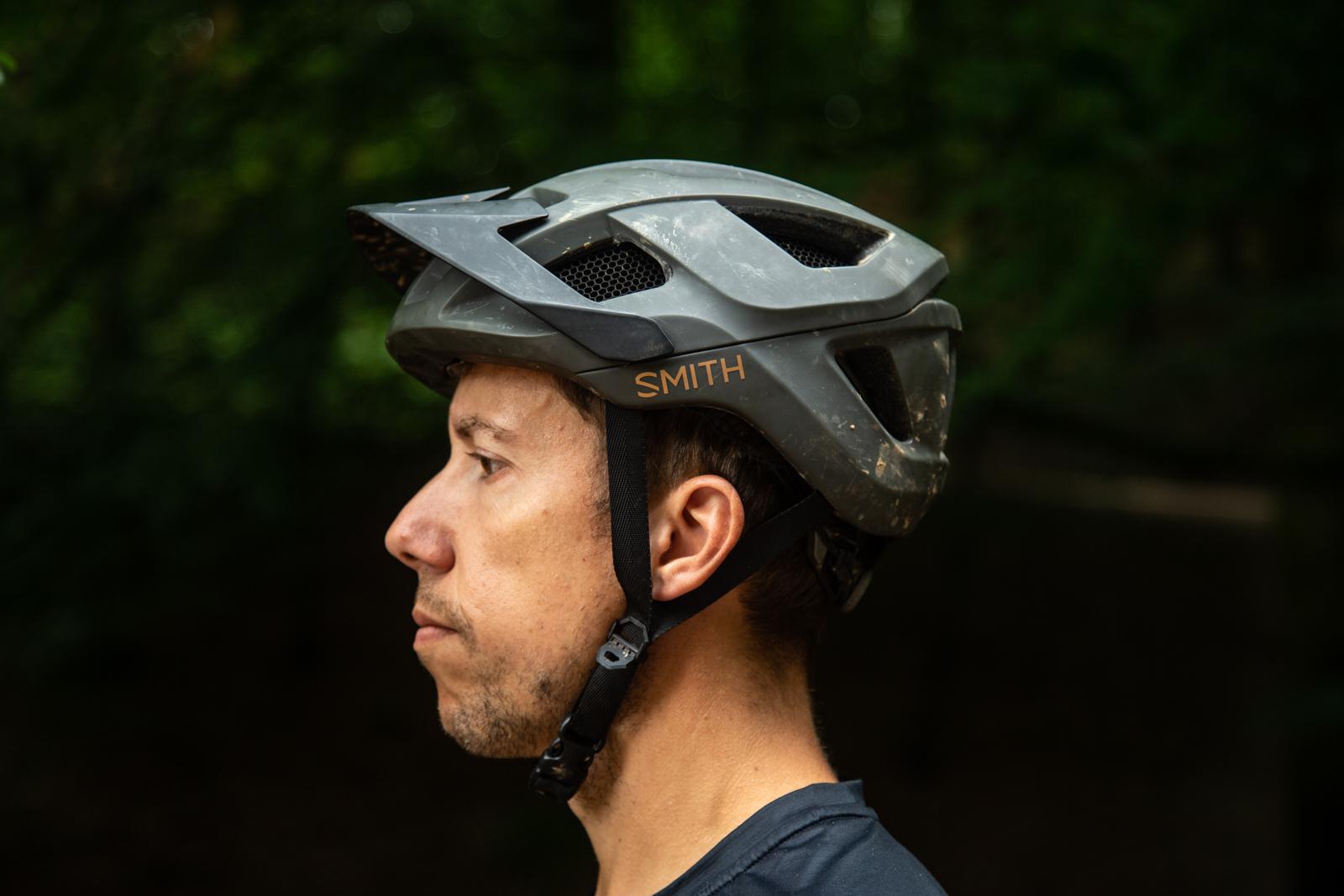 Side profile shot of man wearing Smith Optics Session MIPs mountain bike helmet