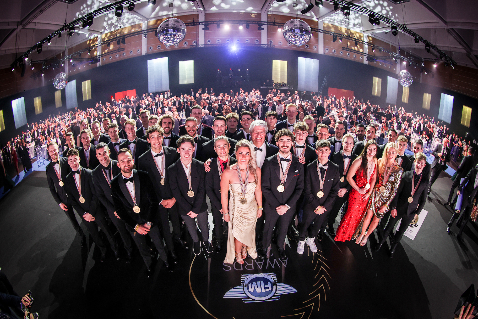 The KTM/FIM crowd at the Rimini Awards ceremony, where KTM received medals for MotoGP's Second Place. Media sourced from a KTM press release.