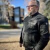 Three-quarter profile of author wearing Merlin Ridge Cotec Jacket