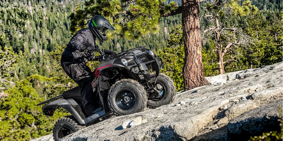 Rider on a 2023 Kawasaki Brute Force 300 climbing up a rockface.