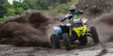 Rider drifting through the dirt on a Scrambler XP 1000 S
