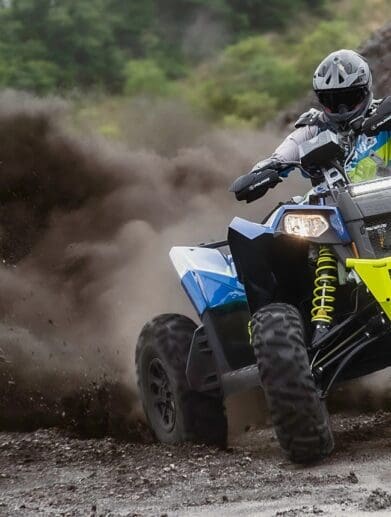 Rider drifting through the dirt on a Scrambler XP 1000 S
