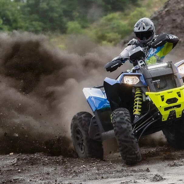 Rider drifting through the dirt on a Scrambler XP 1000 S