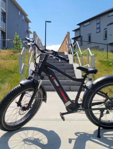 TurboAnt Nebula N1 Electric Bike parked outside near houses