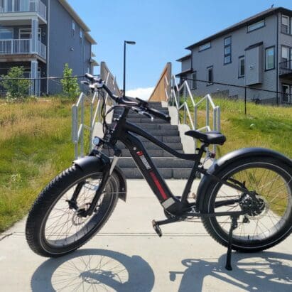 TurboAnt Nebula N1 Electric Bike parked outside near houses