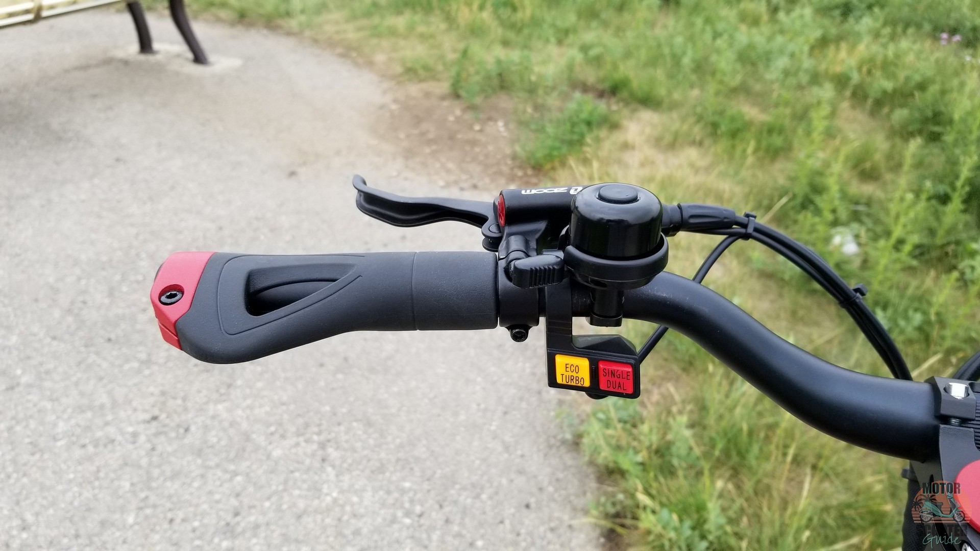Left side of the handlebar showing two buttons for power and motor settings