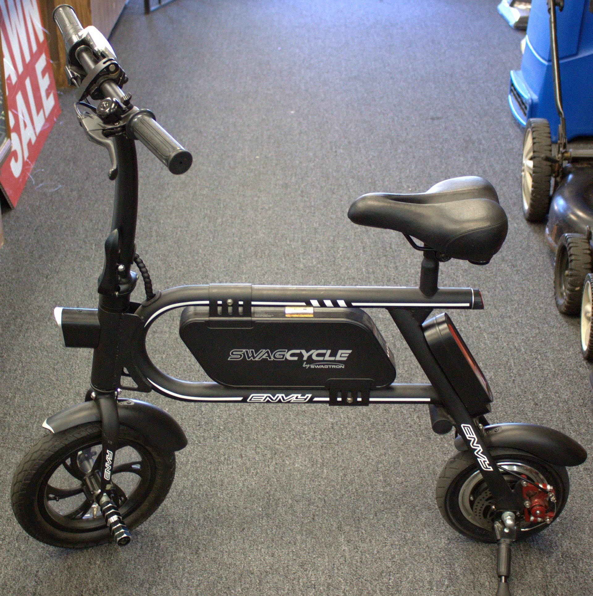 Swagcycle Envy budget eBike standing on kickstand indoors