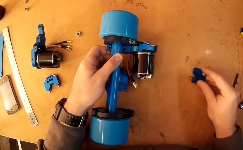 Man assembling hub motor for electric skateboard