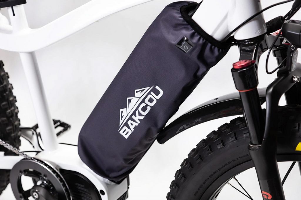 Bakcuo battery cover placed over an electric mountain bike
