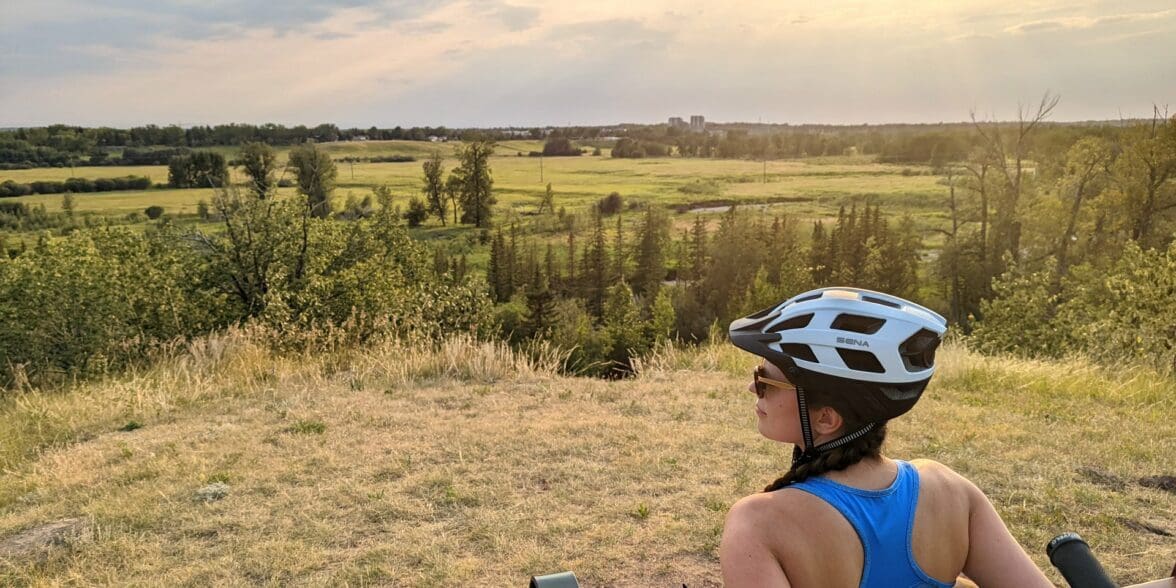 SENA M1 Bluetooth helmet on woman's head as she stares at horizon