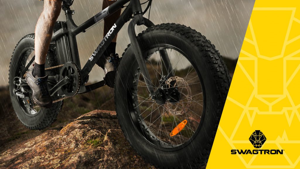 Swagtron fat tire electric bike riding offroad in the rain