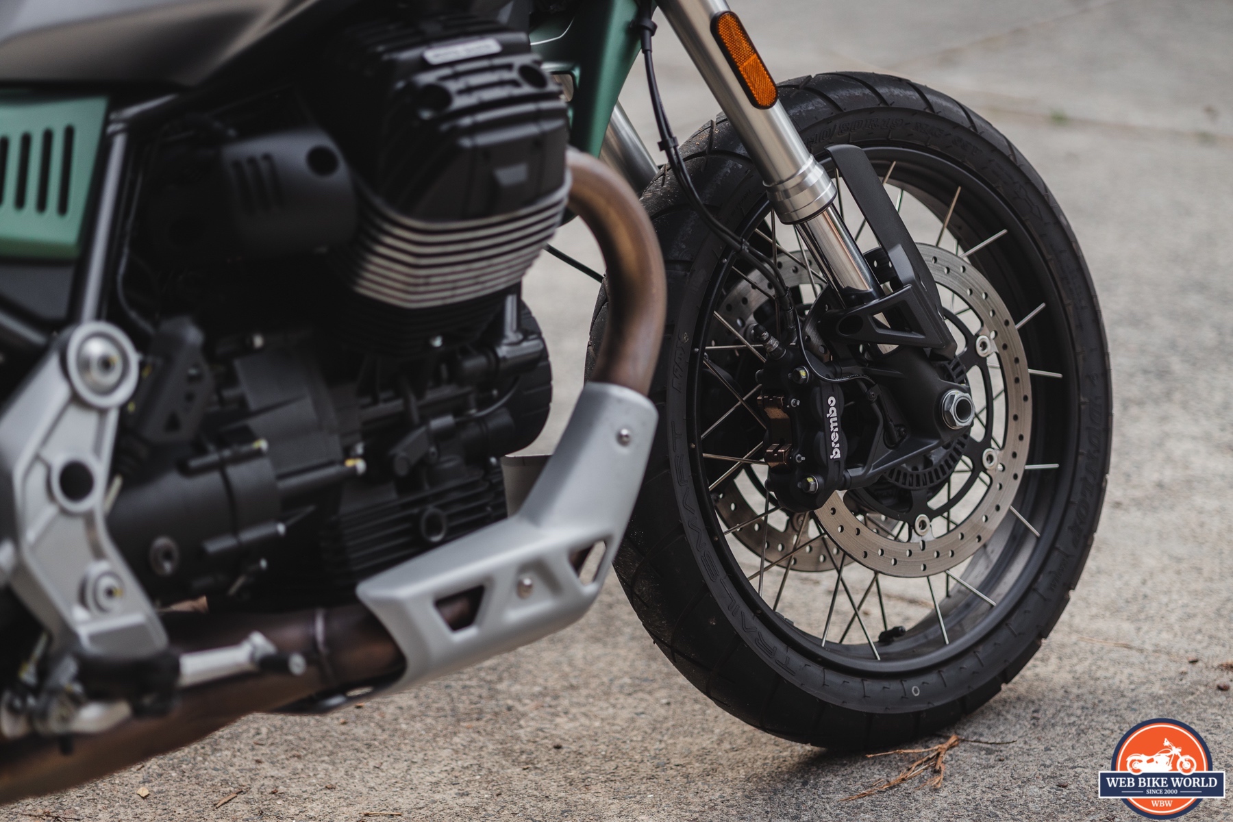 Detail photo of Brembo brakes and front wheel of a 2021 Moto Guzzi V85TT Centenario