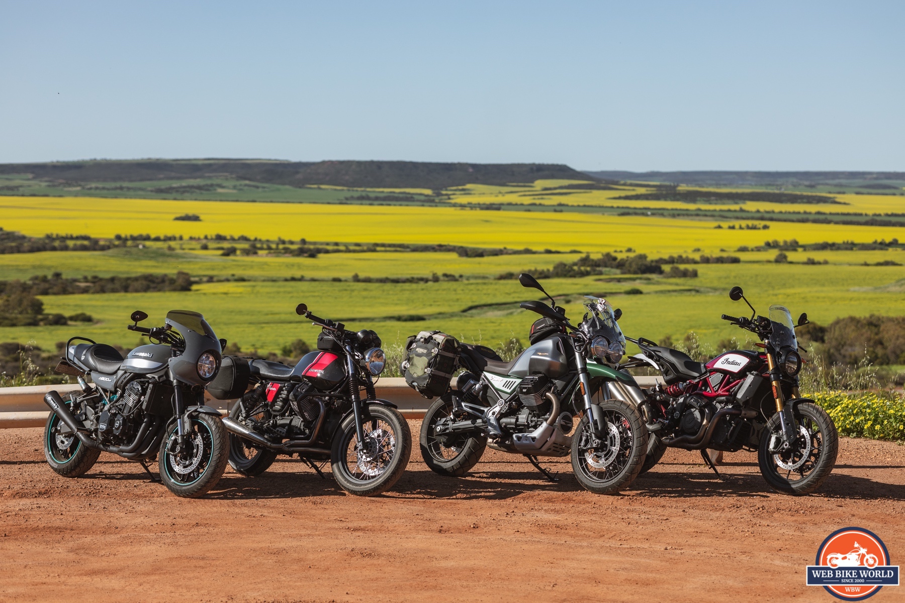  Landscape photo showing a Kawasaki Z900RS Cafe, a Moto Guzzi V7 Special, a Moto Guzzi V85TT Centenario and an Indian FTR1200