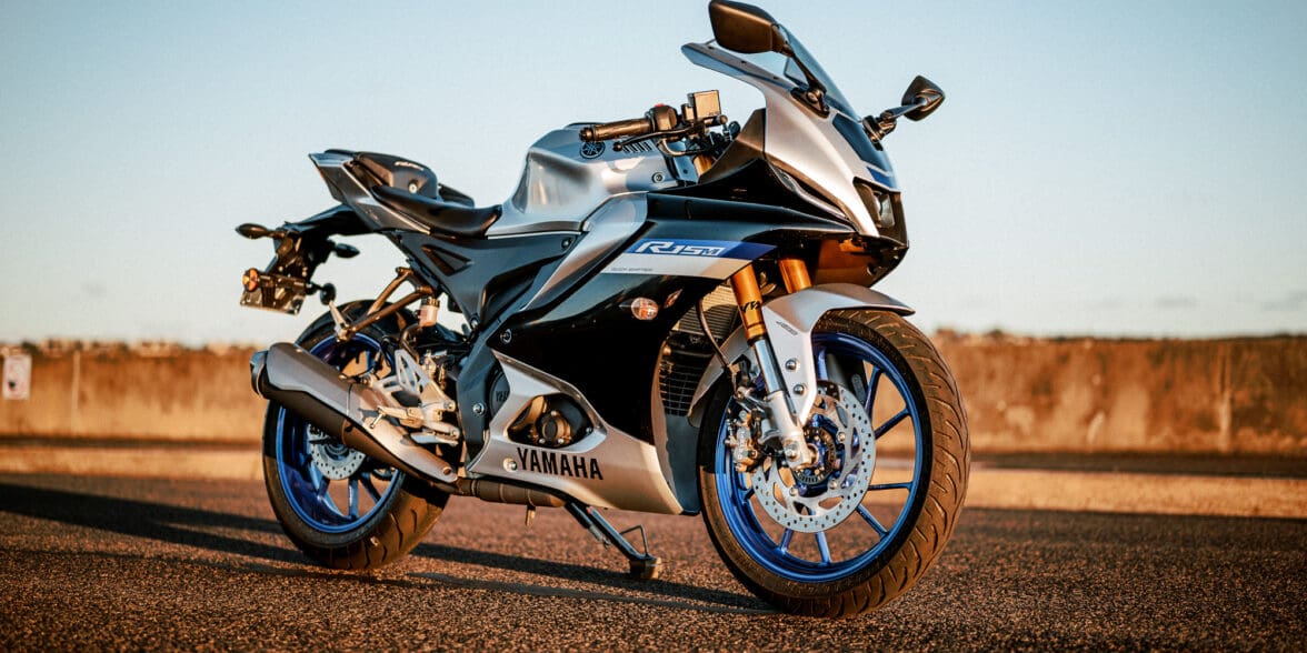 Yamaha's YZF-R15M motorcycle at sunset on a port road in Sydney