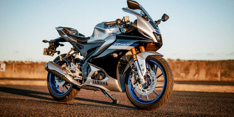 Yamaha's YZF-R15M motorcycle at sunset on a port road in Sydney
