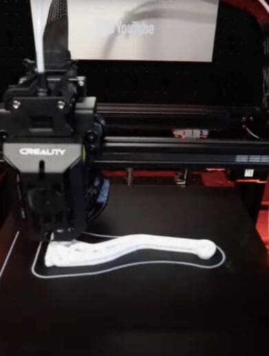 Youtuber Jish on his new Creality Ender-5 S1, which is used to create motorcycle parts for build projects. Media sourced from Jish's video, all relevant rights reserved.