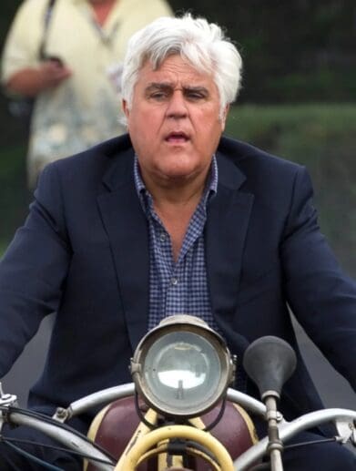 Jay Leno riding one of his vintage motorcycles. Media sourced from Entertainment Tonight.