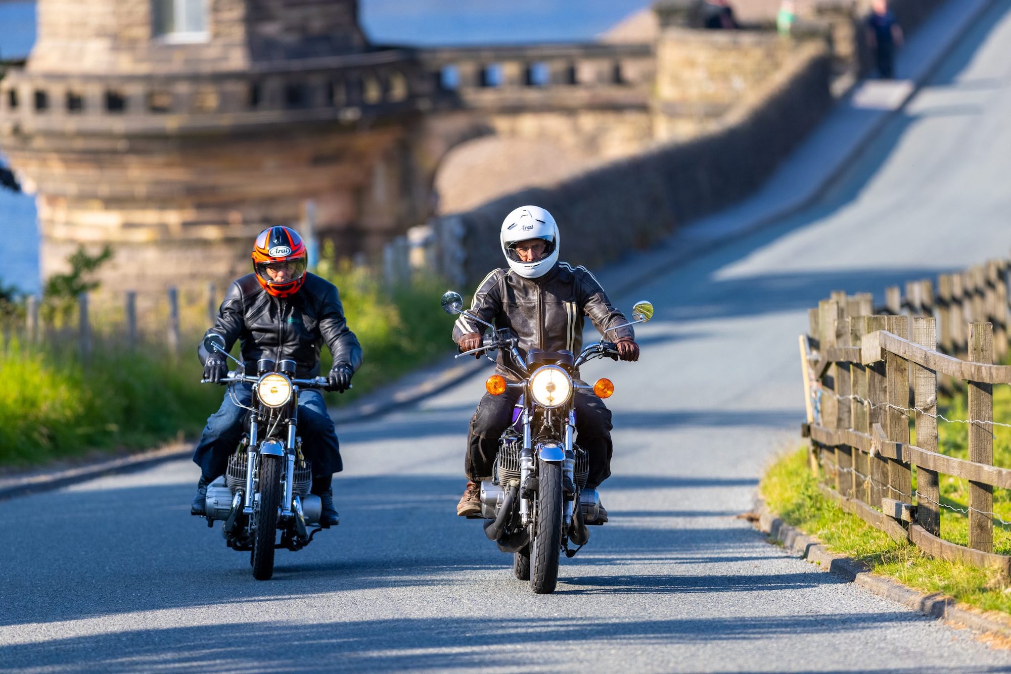 Two motorcyclists enjoying a fine sunny ride. Media sourced from Hagerty UK.