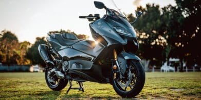 A 2022 Yamaha TMAX Tech MAX Scooter outside at sunset