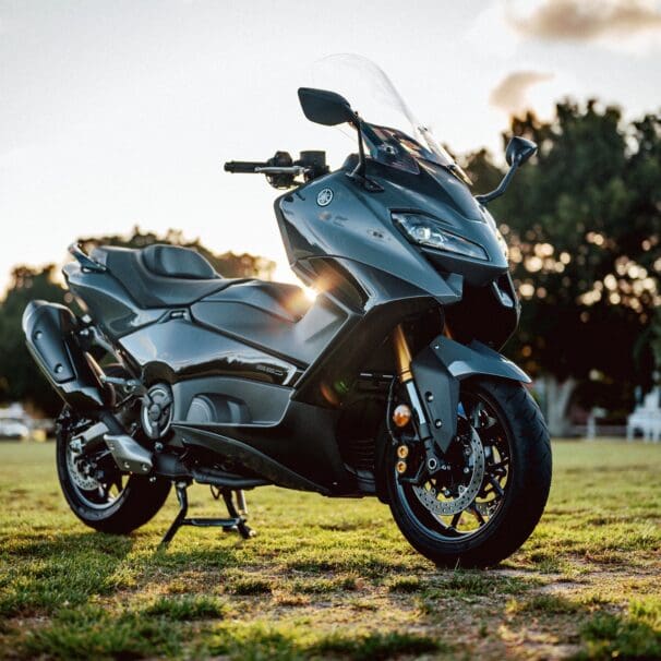 A 2022 Yamaha TMAX Tech MAX Scooter outside at sunset