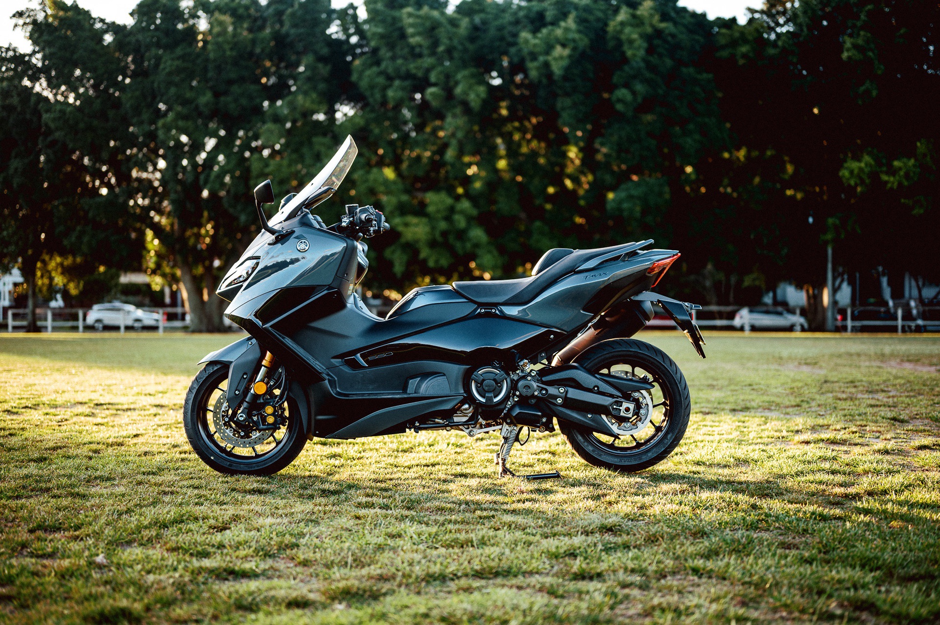 A 2022 Yamaha TMAX Tech MAX Scooter outside at sunset